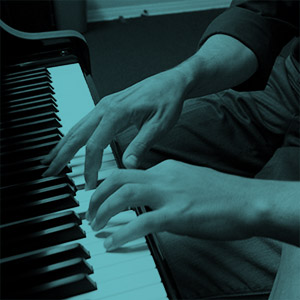 Fingers on piano keys