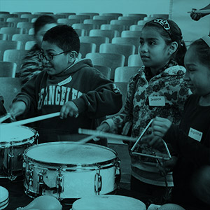 Young musicians playing snare drums