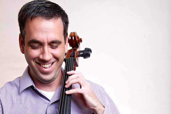 Adult student playing cello