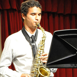 Student playing saxophone in a concert