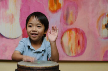 Boy playing bonga drums
