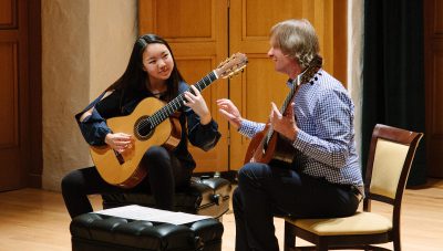 Student and teacher in a classical guitar lesson