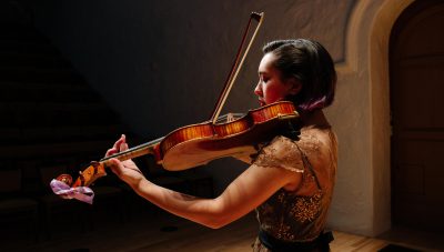 Student playing viola in a concert