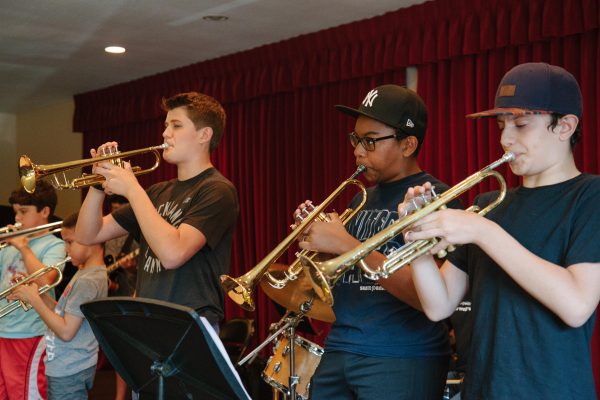 Young musicians playing trumpets