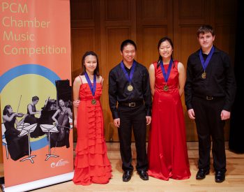 Four musicians with medals