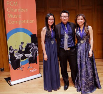 Three musicians with medals