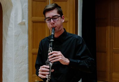 Young man playing clarinet