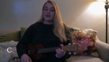 Woman plays ukulele