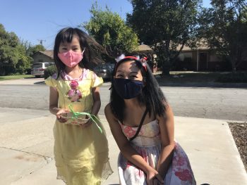 Young girl and woman in masks