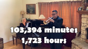 Woman plays piano and man plays trumpet with 