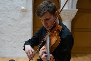 Young man plays violin