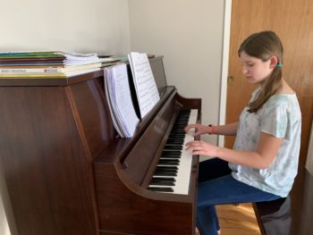 Girl plays piano