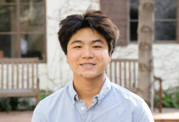 Eddie Zhou smiling in a blue shirt