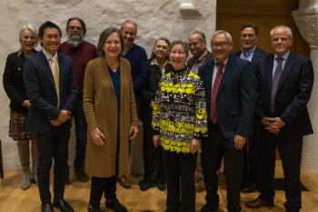 11 Board members (3 women and 8 men) pose in Barrett Hall.