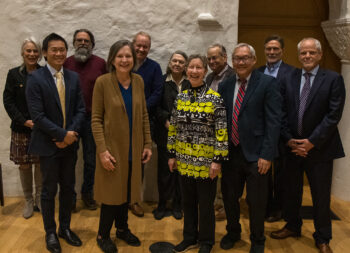 11 Board members (3 women and 8 men) pose in Barrett Hall.